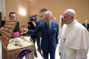 Pope Francis exchanges gifts with Britain's Prince Charles and his wife Camilla, Duchess of Cornwall, during a private audience at the Vatican